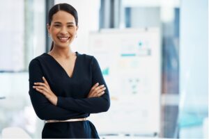 A person in a black dress with her arms crossed, Mastering Healthcare Practice Efficiency: The Power of an Effective Executive System